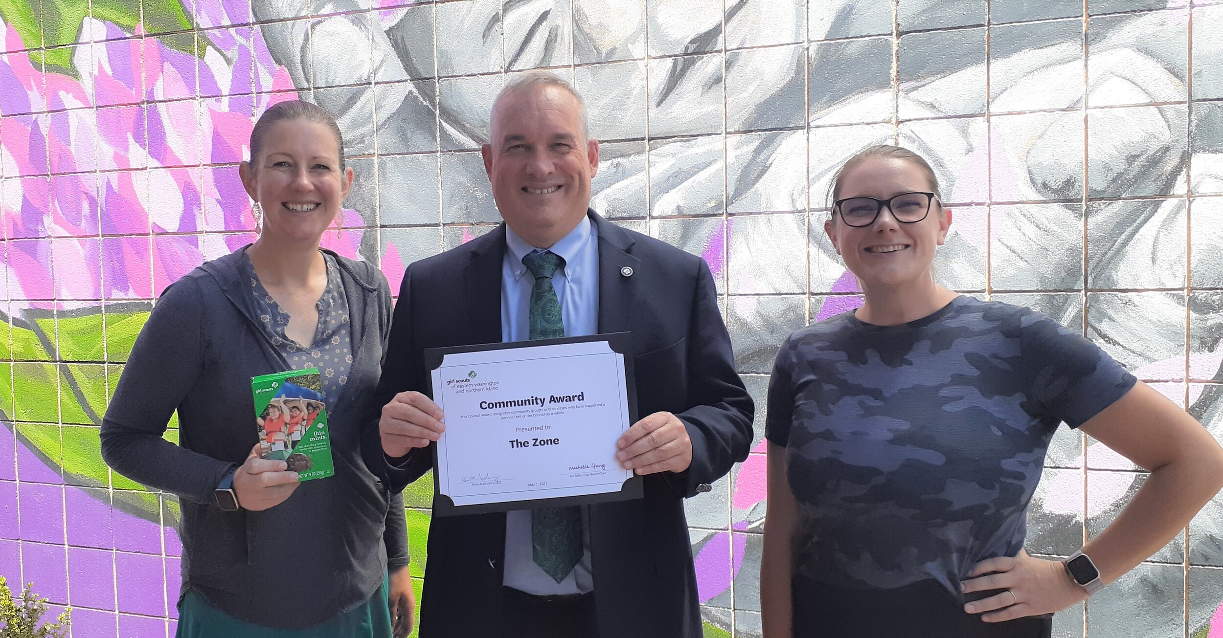 Girl Scouts Executive Director Brian Newberry presenting the Community Award to The ZONE with Amber Waldref, Director and Krysten Proszek, Expanded Learning Coordinator.
