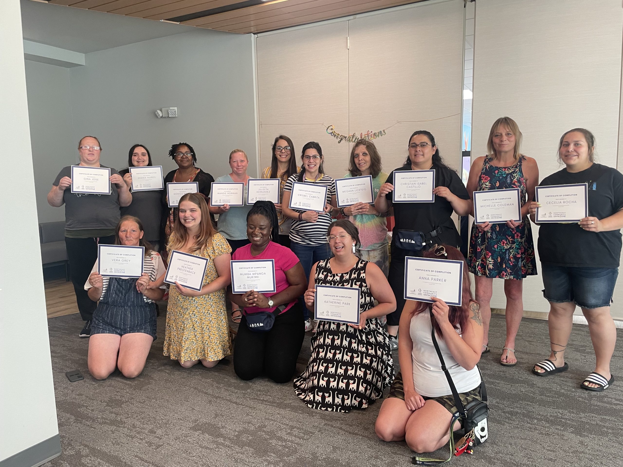Group of women each holding certificates | Essential Skill | The ZONE